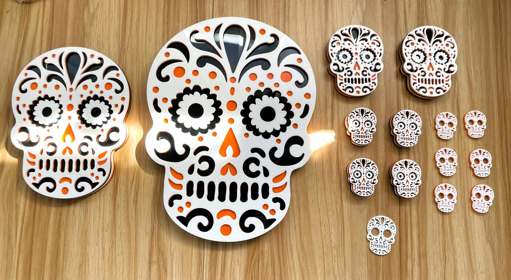 Decorative sugar skull designs on a wooden surface