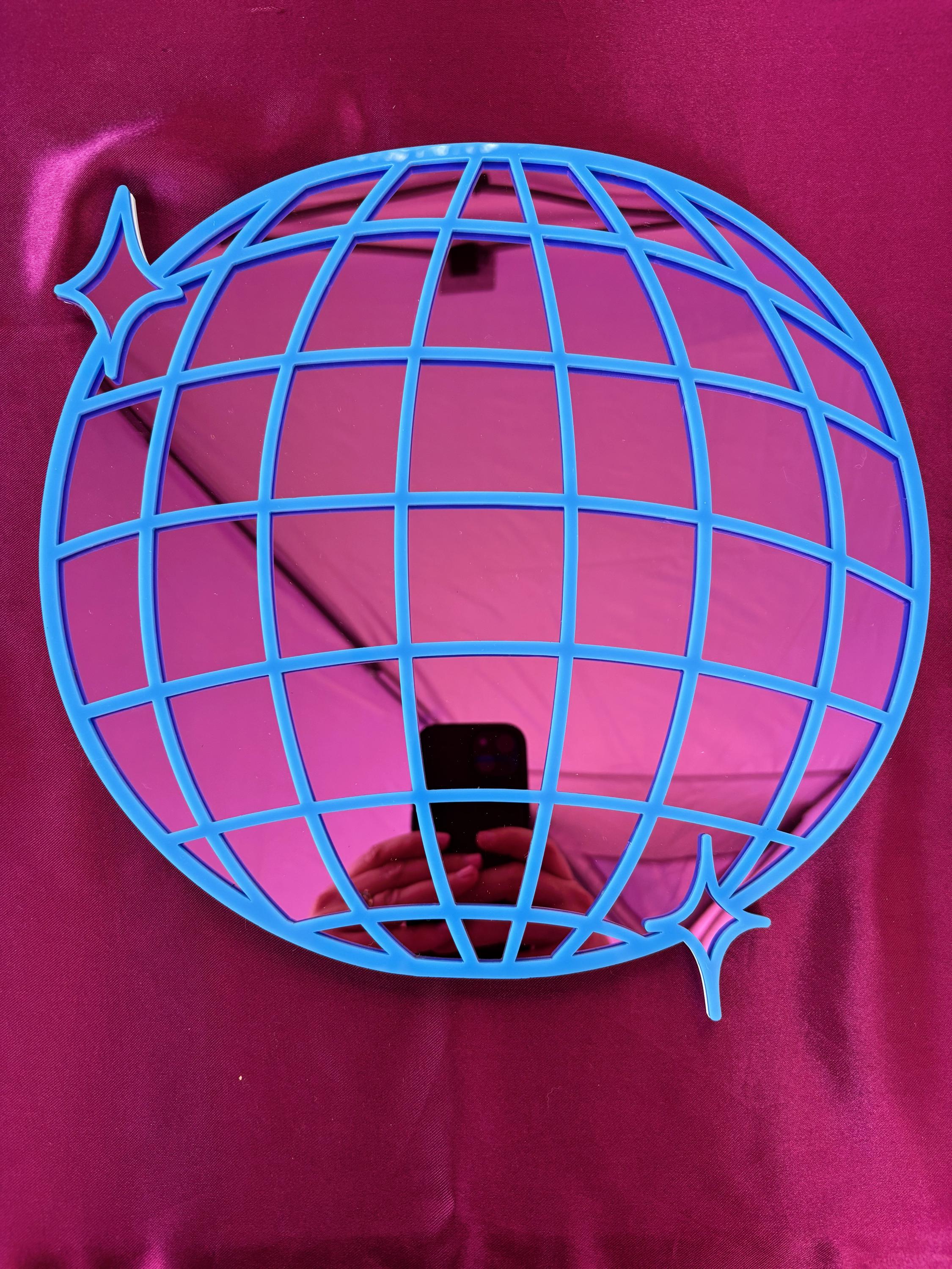 Blue wire globe design on a pink background