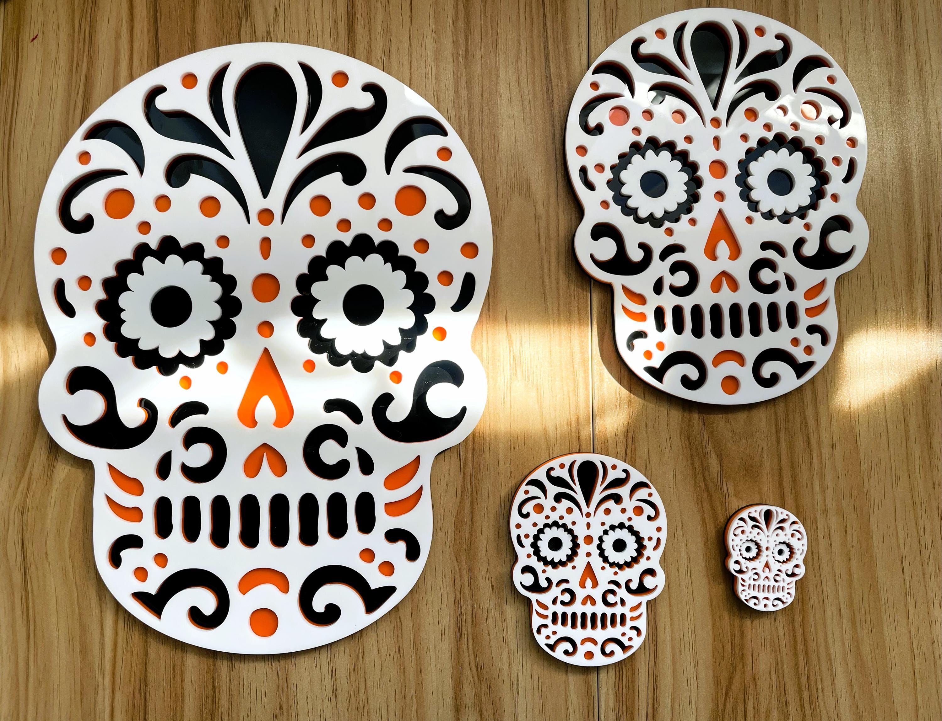 Set of decorative sugar skull designs on a wooden surface