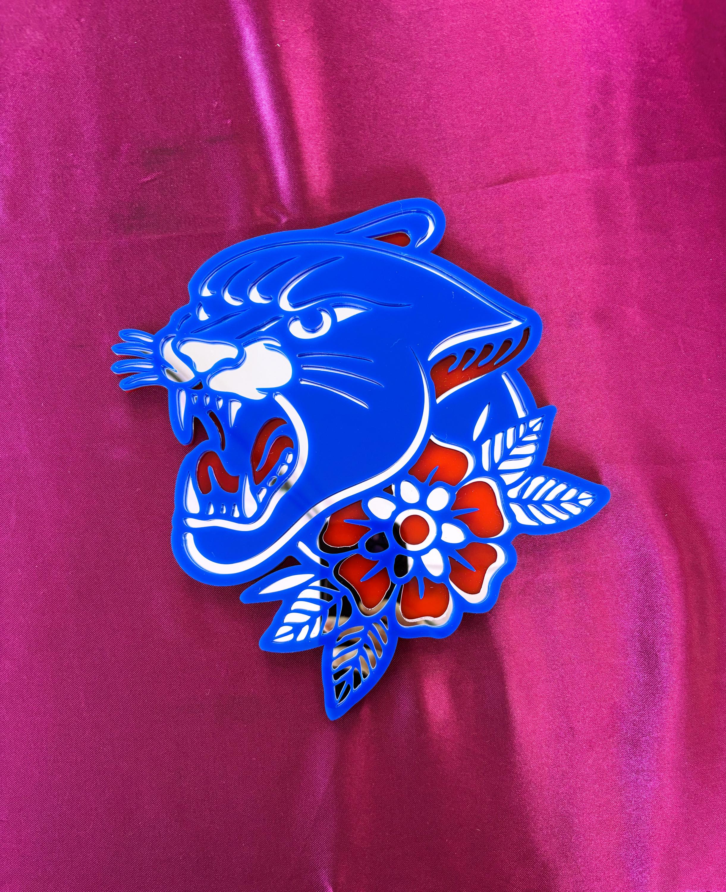 Blue panther design with flowers on a pink background