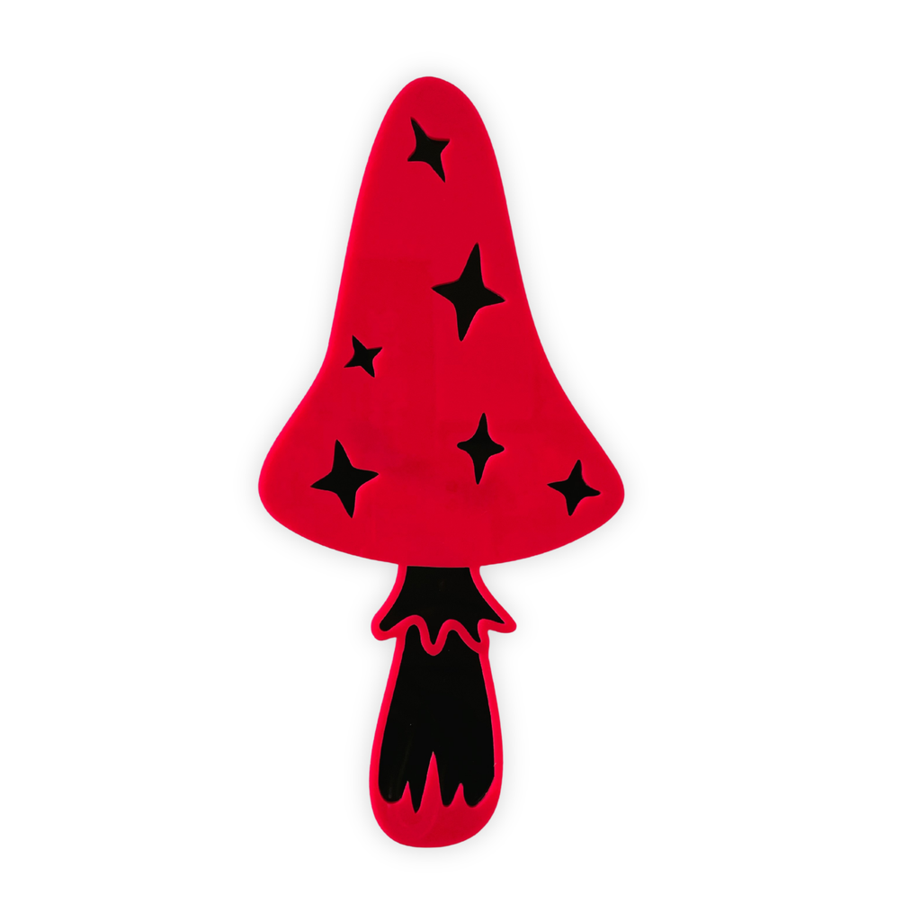 Red mushroom-shaped object with black star patterns on a white background