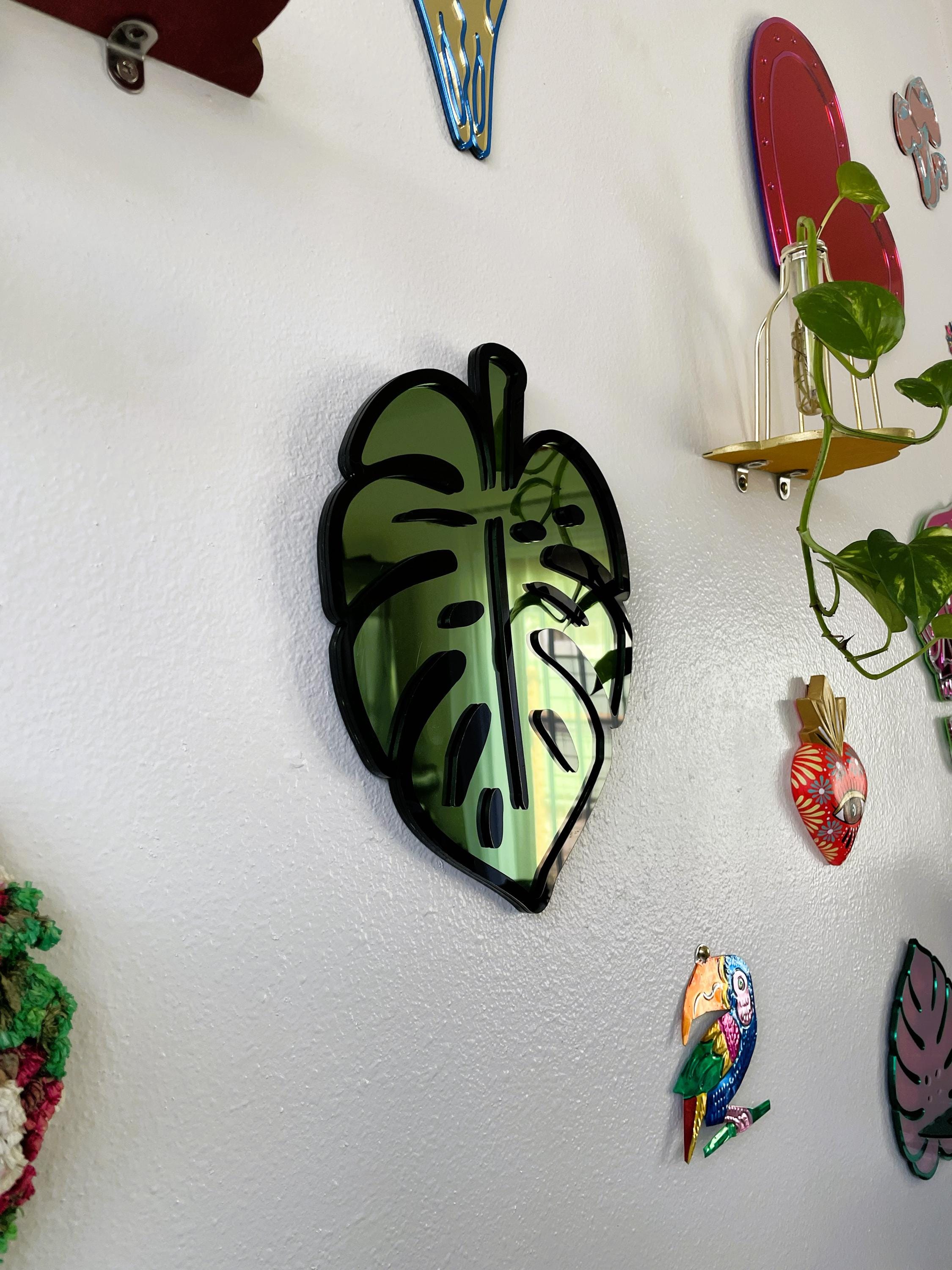 Colorful leaf-shaped magnets on a white refrigerator