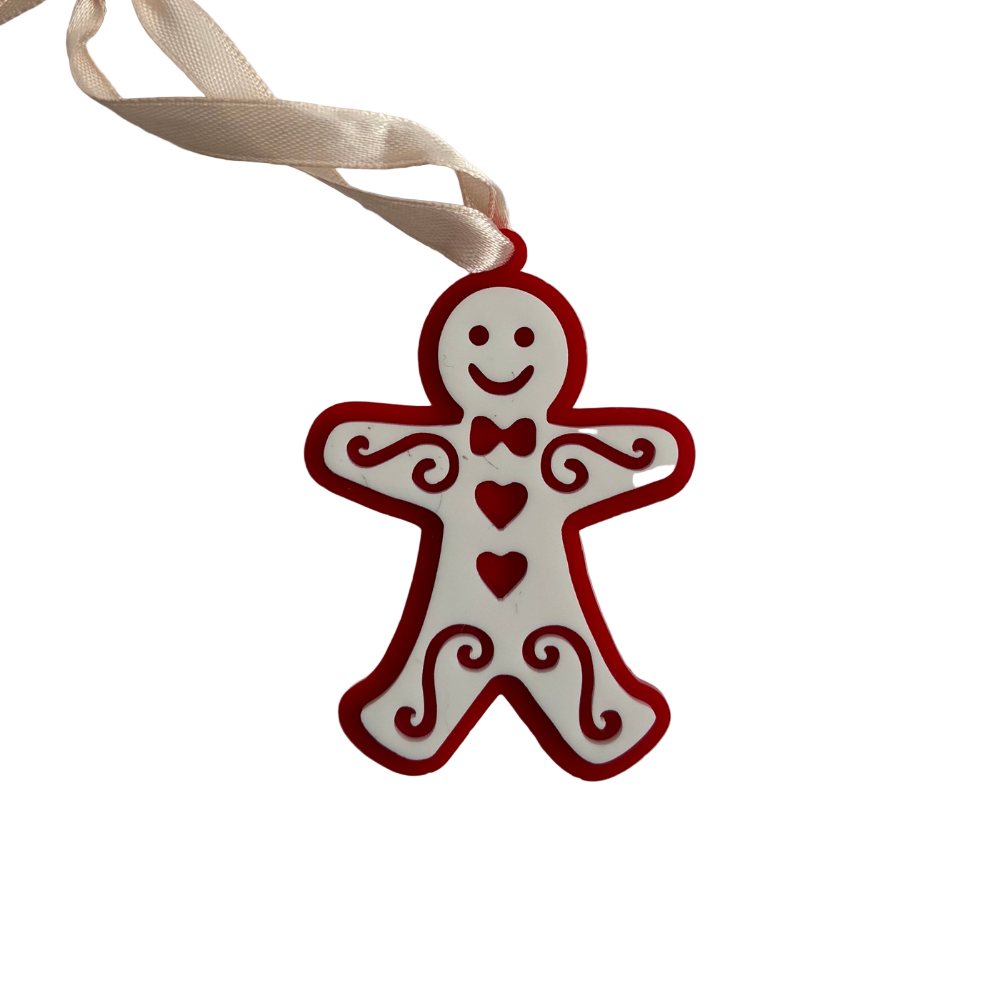 Red gingerbread man ornament with a ribbon on a light gray background